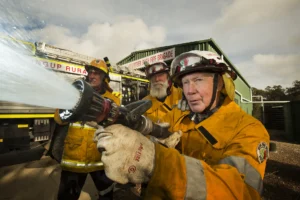 Closeup of firemen on the hose